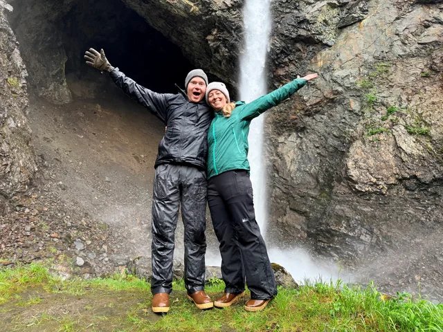 Guests beside a waterfall