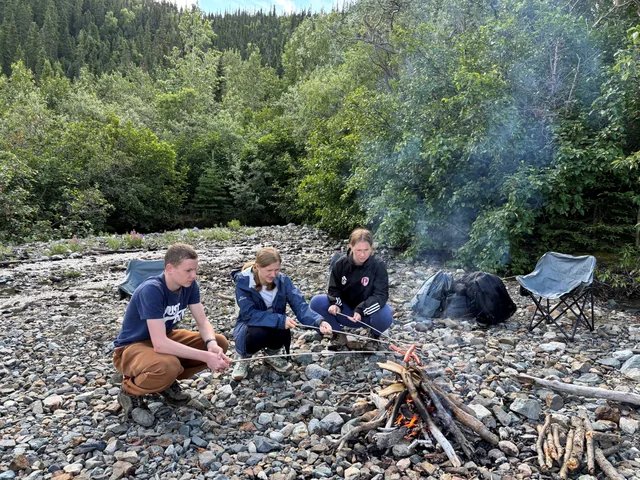 Guests gathered around a shore fire