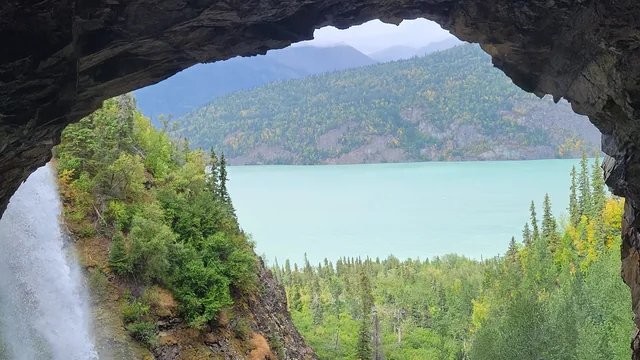 Looking out from behind a waterfall