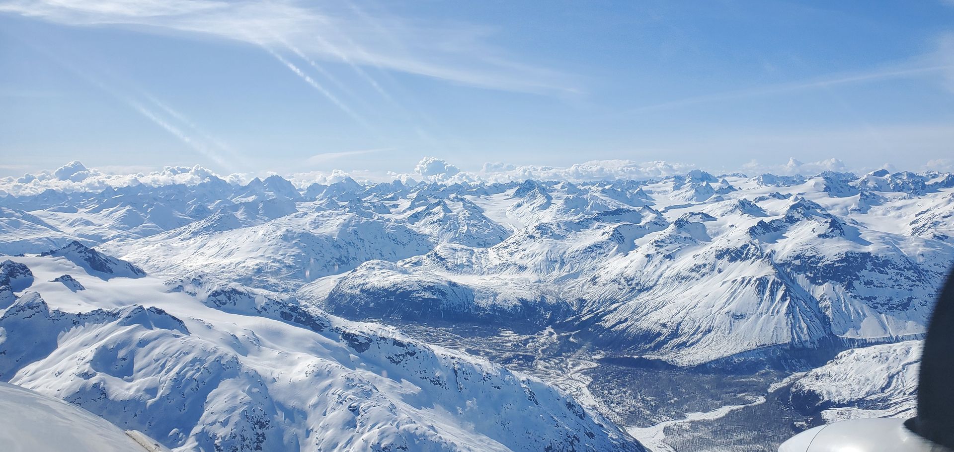 Snow-covered mountains on the flight through Lake Clark Pass