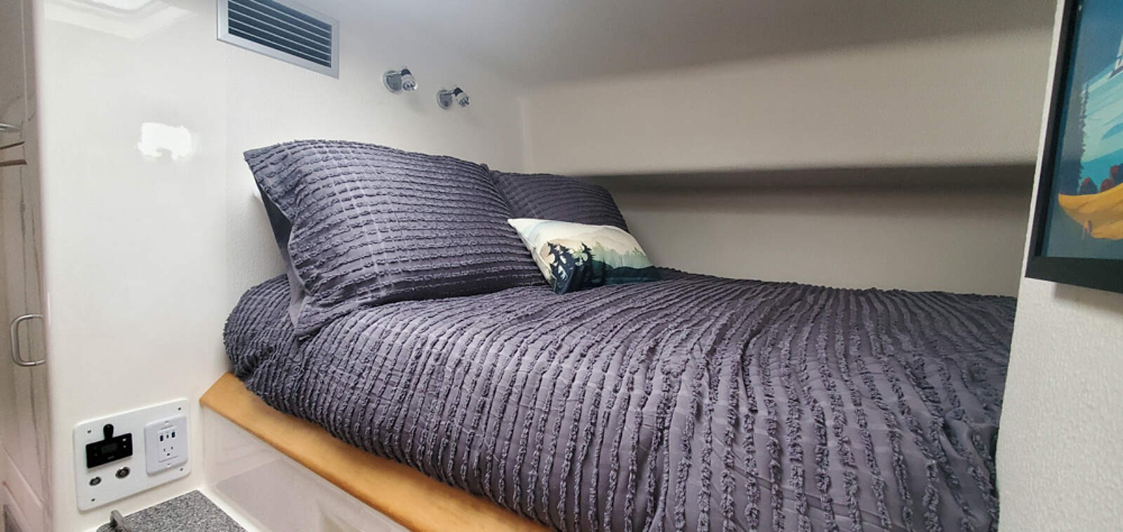 A queen guest cabin aboard Odyssey